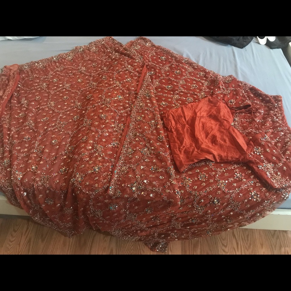 Indian wedding lehenga. Heavy stone work. Rust